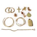 Gold items comprising; Four gold charms, seated poodle, bulldog, windmill,