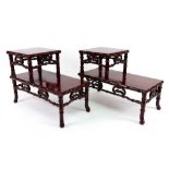 A pair of Chinese rosewood stepped two tier miniature table stands, second half 20th century,