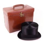 A Rowe of Bond Street black silk top hat, by appointment to Her Majesty Queen Mary,
