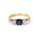 A sapphire and diamond three stone ring,