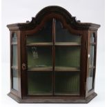 A small Dutch 18th century style mahogany wall hanging cabinet, incorporating earlier elements,