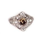 A gold, cinnamon diamond and old-cut diamond panel ring, the central brilliant cut stone approx. 0.