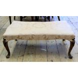 A Victorian mahogany frame stool, circa 1860, of shaped rectangular outline,