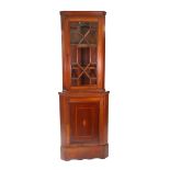An Edwardian mahogany satinwood crossbanded boxwood and ebony strung floor standing corner cabinet,