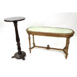 A reproduction Louis XV style carved giltwood oval low table, with inset glass top, on turned,