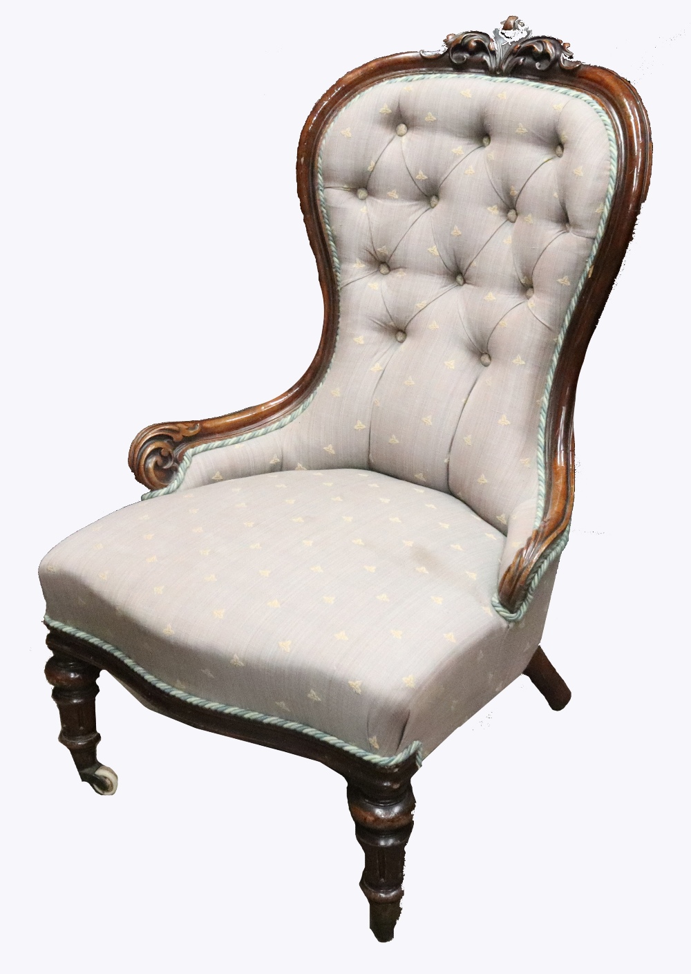 A Victorian walnut frame foliate carved nursing chair, button down upholstered,