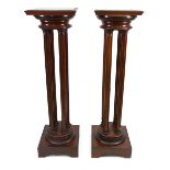 A pair of Empire style mahogany gilt metal mounted torchere, circa 1900,