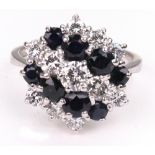 A modern sapphire and diamond cluster ring,