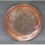 An Arts & Crafts circular copper tray,