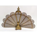 A Louis XV style gilt metal fan shape fire guard, late 19th/early 20th century,