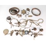 Assorted silver and white metal jewellery to include; a hinged bangle, a filigree panel bracelet,