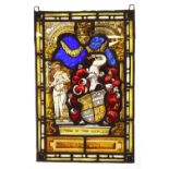 A 16th century lead framed stained glass panel, decorated with a double arch centred by a crown,