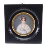 After Greuze, A portrait miniature of a lady in a white dress with a pink flower,