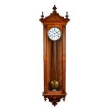 A Vienna style walnut cased wall timepiece, late 19th century, of large proportions,