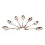 A collection of seven Dutch silver Hanoverian pattern table spoons, including three Amsterdam 1836,