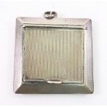 An Art Deco square engine turned silver pendant compact, London 1922, 4.8cm, inscribed.