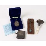 A large Victorian silver vesta case, Deakin & Francis, Birmingham 1898, monogrammed, a silver spoon,