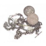 Two Victorian silver crowns, 1889 & 1890, a Victorian twisted oval link silver watch chain,