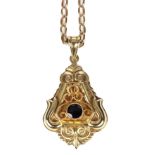 A continental 14ct yellow gold and garnet pendant, of symmetrical scroll triangular design,