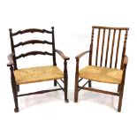 A George III style oak frame ladder back low rush seated elbow chair, circa 1900,