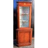 A reproduction George III style mahogany boxwood strung floor standing corner cabinet,