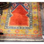 A Turkish Karapinar rug, with red mihrab shaped field and tan border, 164 x 140cm.