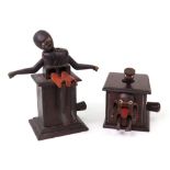 Two carved wooden Japanese Kobi toys, one of a figure sat on top of a box with legs,