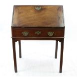 A George III mahogany bureau, altered, the hinged fall enclosing a fitted interior, drawer below,
