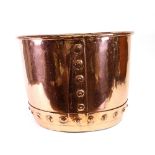 A circular polished copper cistern log tub, with studded bands, 46cm diameter.