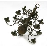 A Dutch brass 12-light chandelier, 19th century, in 18th century style, the scrolled branches,