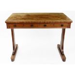 A late Regency mahogany library table, the well figured top with rounded corners,