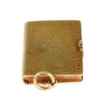 A Victorian gold stamp box, modelled as a book,