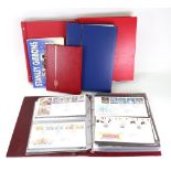 Great Britain - a large collection of First Day covers in three red albums,