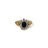 A 9ct yellow gold sapphire and diamond oval cluster ring,