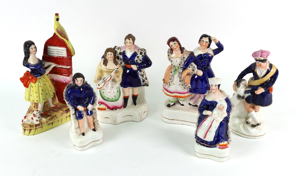A collection of Victorian Staffordshire, Queen Victoria and Prince Albert seated, 14cm high,