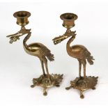 A pair of cast gilt bronze crane candlesticks, late 19th century, with frogs in their beaks,