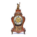 A Louis XV gilt metal mounted scarlet tortoiseshell and cut brass 'Boulle' marquetry bracket clock