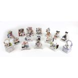 A collection of fourteen Victorian porcelain fairings,