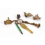 Two Victorian novelty gold plated watch keys formed as dog’s heads,