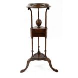 A reproduction mid 18th century style mahogany wig stand, with open circular top,
