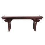 A Chinese stained pine altar table, the rectangular top with curved ends, above a carved frieze,
