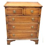 A reproduction George III style mahogany satinwood crossbanded boxwood and ebony strung chest,