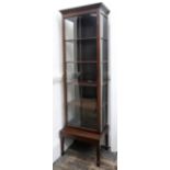 A George III style mahogany display cabinet, 19th century and later,