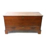 A mid 18th century oak mule chest, with moulded hinged top, drawer below, on later bracket feet,
