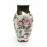 A Japanese porcelain vase, 20th century, enamelled with vases, stands, insects, flowers, vegetables,