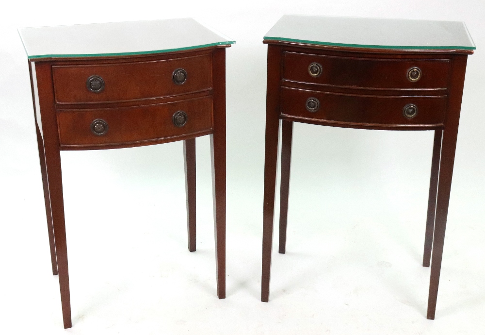 Two similar reproduction George III style mahogany bow fronted two drawer side tables,