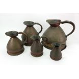 A graduated set of five Victorian copper haystack jugs, Imperial 2 gallons - pint.