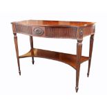 A George III style mahogany serpentine fronted serving table, stamped T.