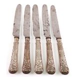 A set of five George IV silver handled table knives, J Rogers, Sheffield 1823, with floral, thistle,