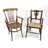 An Edwardian mahogany rosewood bone and boxwood strung and inlaid salon elbow chair with tapestry
